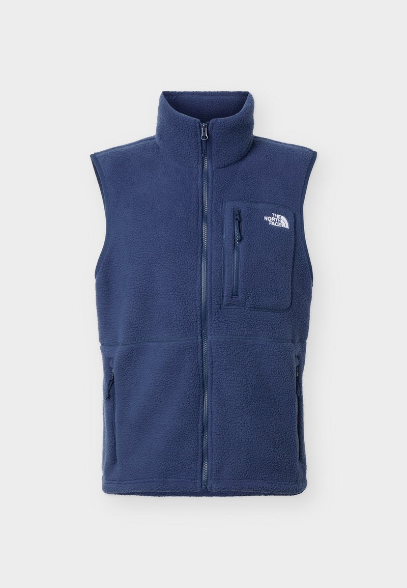 Marineblaue, ärmellose Fleeceweste mit durchgehendem Frontreißverschluss, Reißverschlusstasche auf der Brust, Seitentaschen und The North Face Logo auf der Brusttasche.