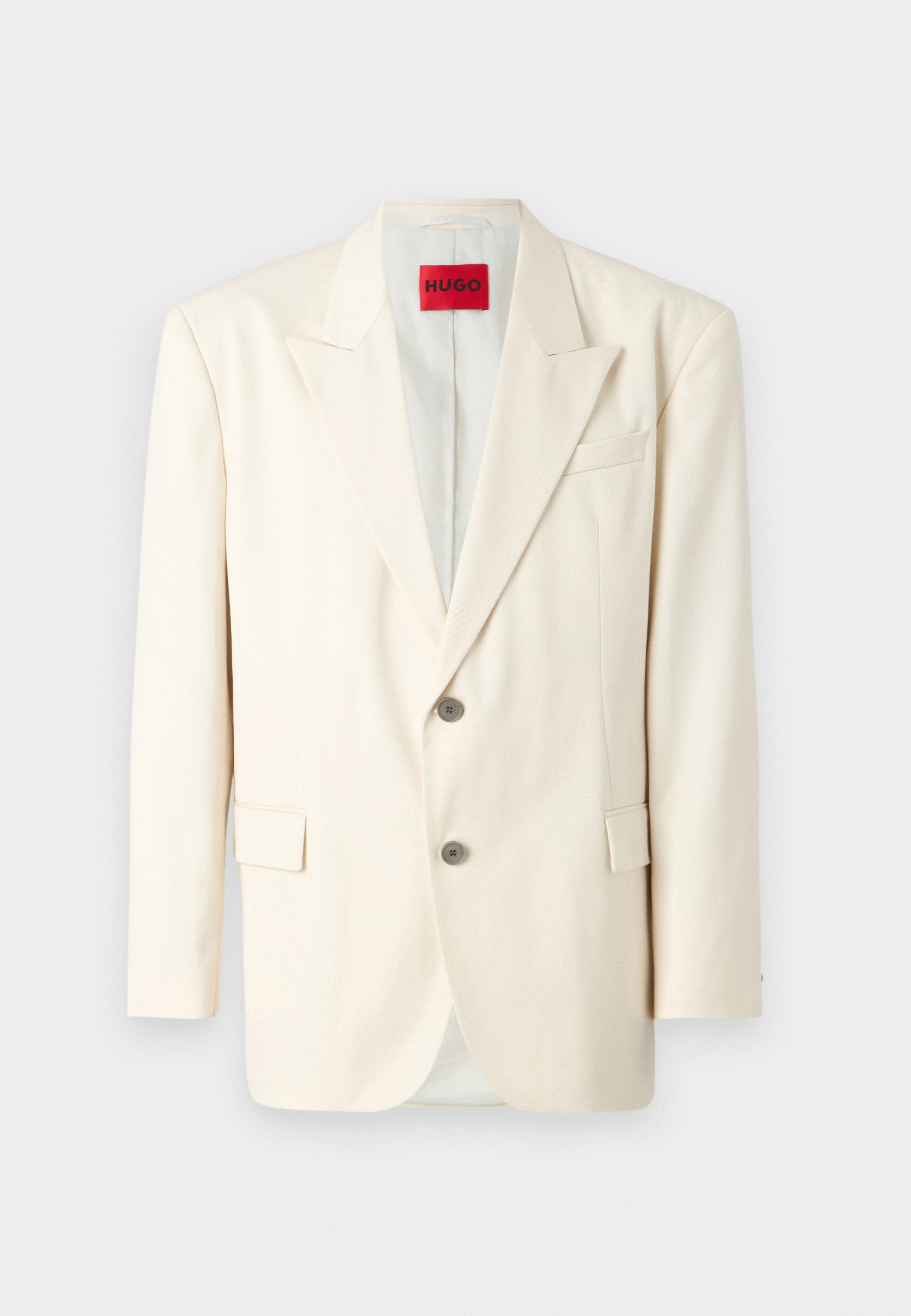 Helle beige taillierte Blazer mit Revers, zwei vorderen Knöpfen, einer Brusttasche und Seitentaschen, aus glattem Stoff. Markenlabel sichtbar.