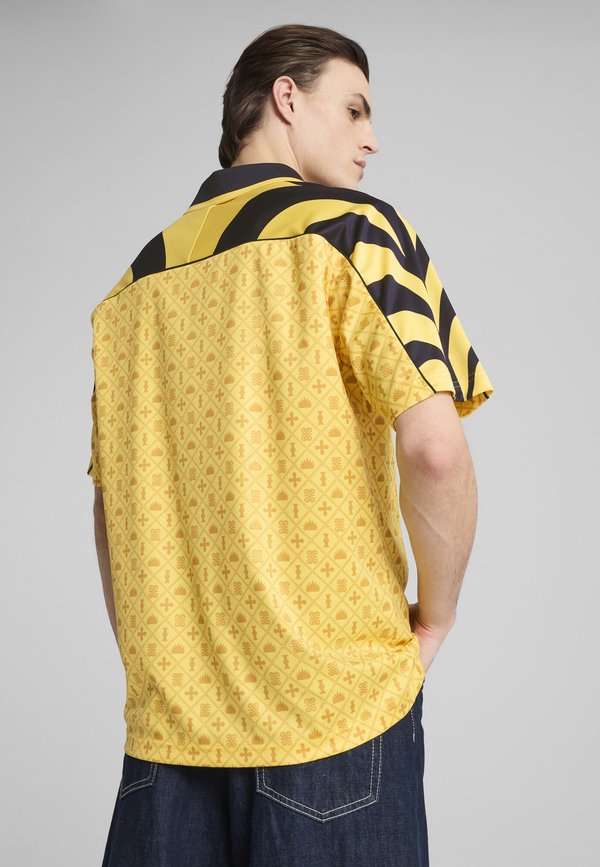 Puma ROAD TO UNITY - Print T-shirt - sunny yellow