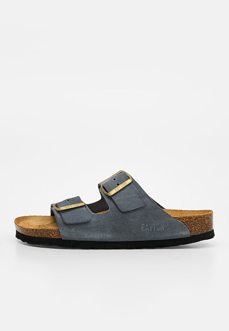 Legerer dunkelgrauer Slide-Sandal mit zwei verstellbaren Schnallenriemen, Korkfußbett und schwarzer strukturierter Sohle.