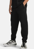 Under Armour UNSTOPPABLE FLEECE - Tracksuit bottoms - ultimate black