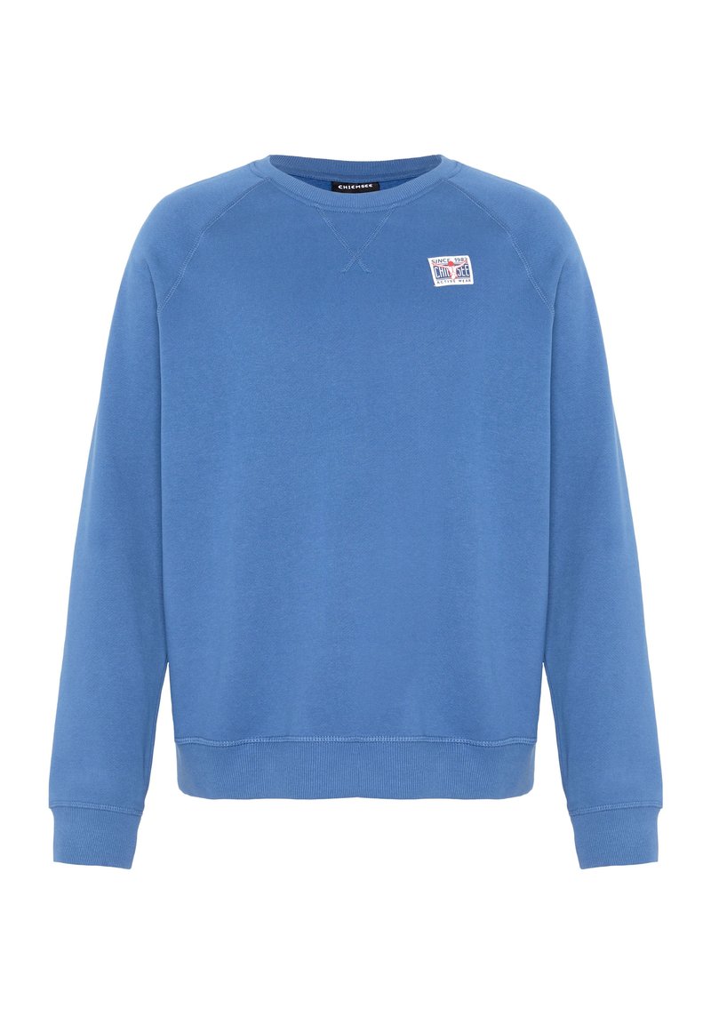 Blauer Pullover mit rundem Halsauschnitt, gerippten Bündchen und Saum. Verfügt über ein kleines Logo-Emblem auf der Brust. Weicher, strukturierter Stoff.