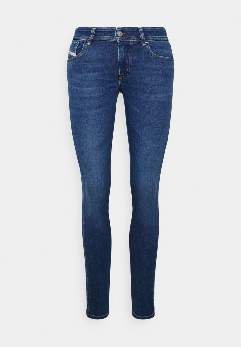 Schmale Jeans aus mittlerem blauen Denim. Verfügt über fünf Taschen, einen Knopf- und Reißverschluss sowie dezente Ausbleichungen an den Oberschenkeln. Klassisches Design.